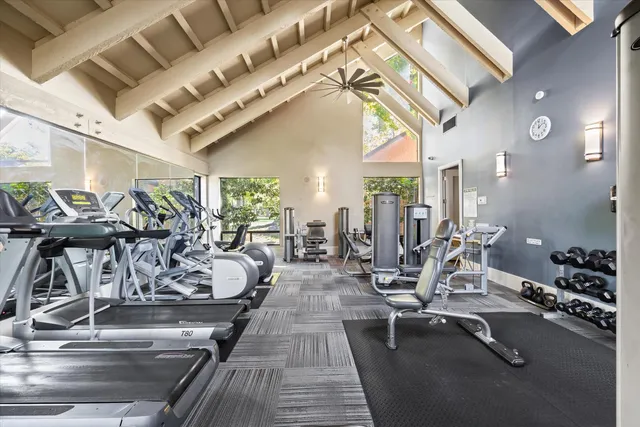 a living room with lots of furniture and a chandelier