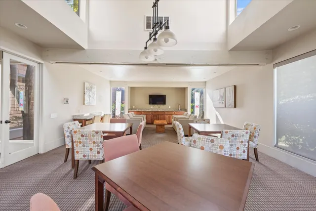 a view of a park with bench and trees