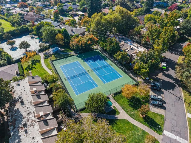 an aerial view of a house with a yard and garden