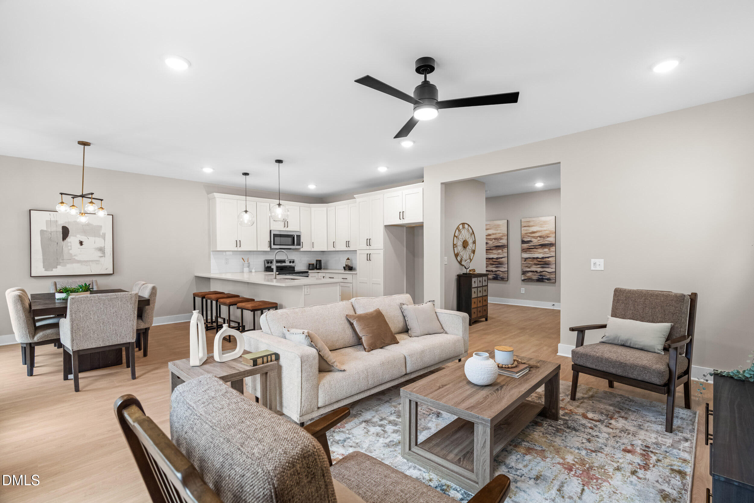 1012 Harper Road Raleigh, NC 27603 - Photo 11 of 55 a living room with furniture and a view of kitchen