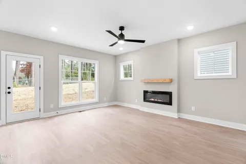 a large kitchen with kitchen island a stove a sink and a refrigerator