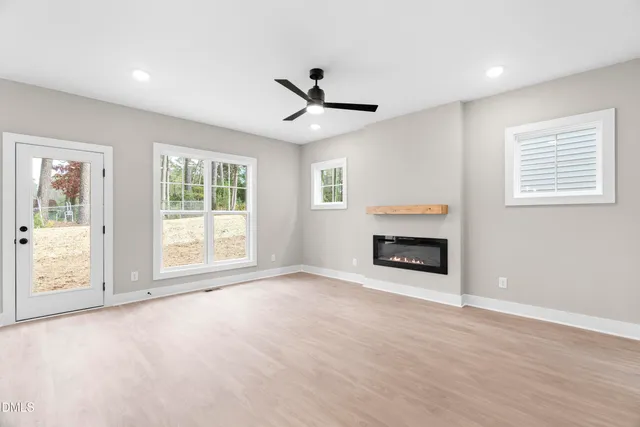 a large kitchen with kitchen island a stove a sink and a refrigerator
