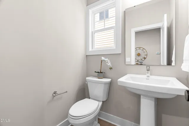 a en suite bathroom with a sink and a mirror