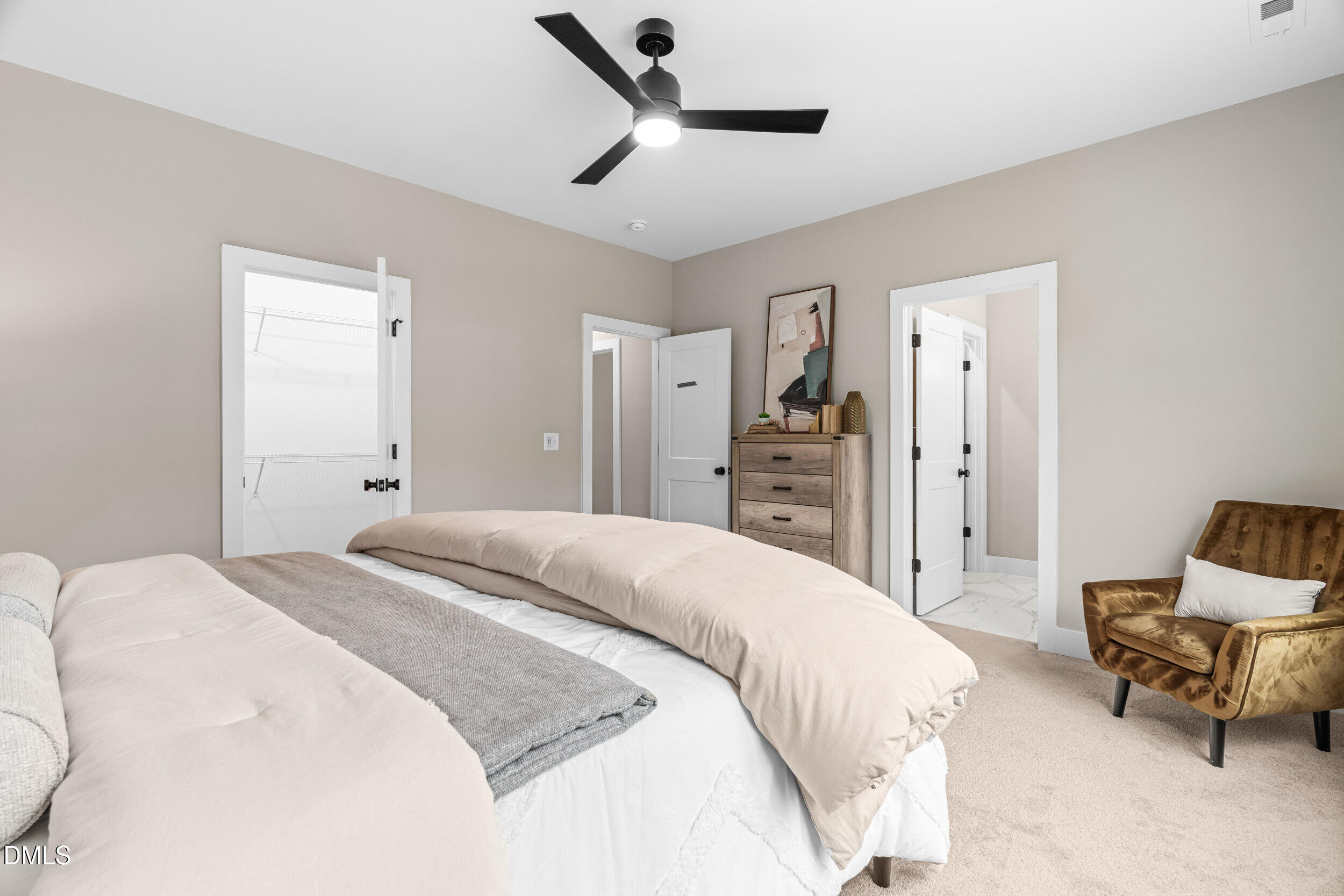 1012 Harper Road Raleigh, NC 27603 - Photo 19 of 54 a spacious bedroom with a bed and a refrigerator