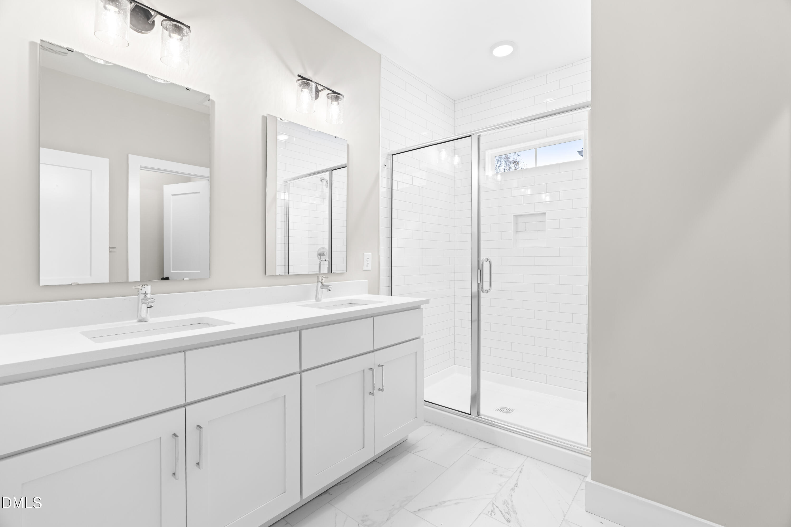 1012 Harper Road Raleigh, NC 27603 - Photo 20 of 42 a bathroom with a double vanity sink and mirror