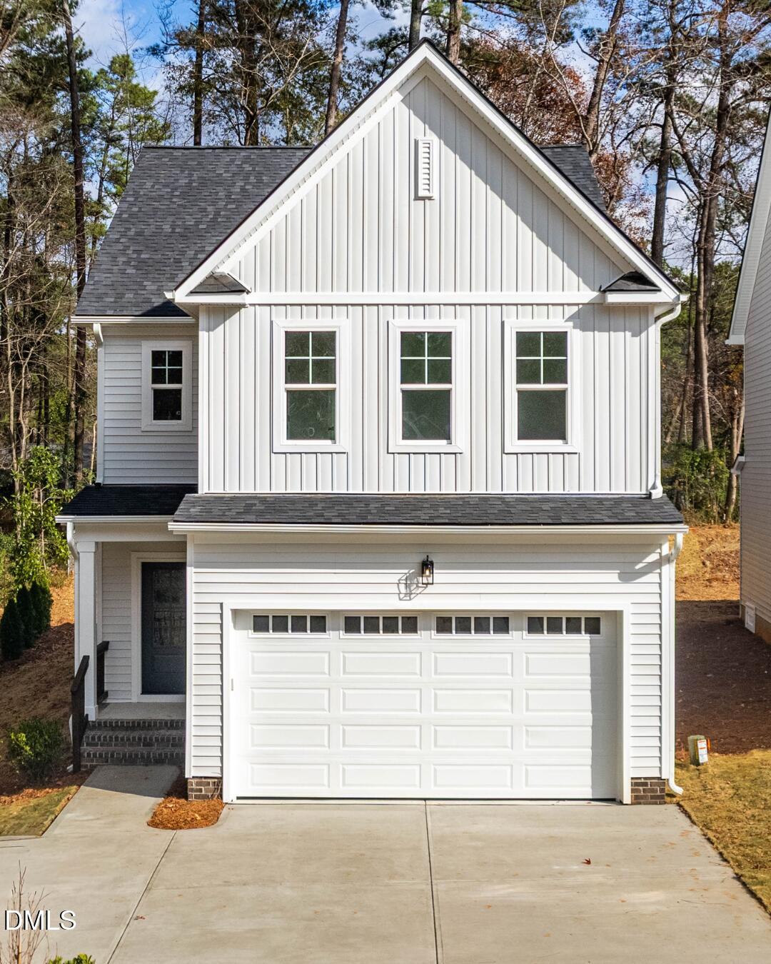1012 Harper Road Raleigh, NC 27603 - Photo 2 of 42 a view of a house with a yard and garage