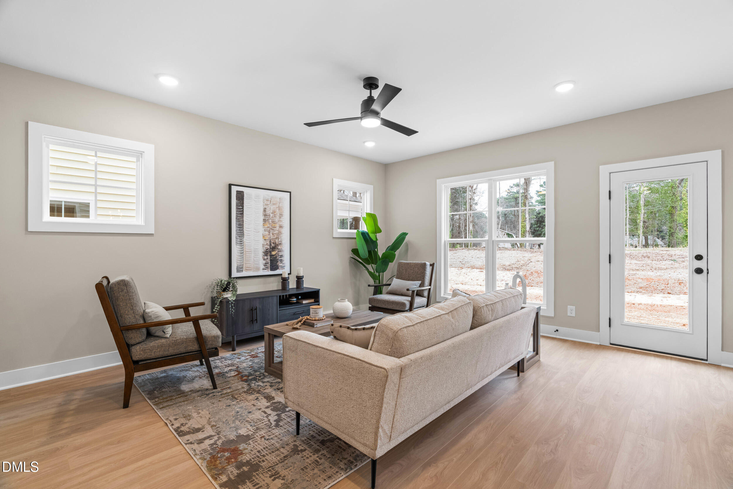 1012 Harper Road Raleigh, NC 27603 - Photo 7 of 54 a living room with furniture and wooden floor