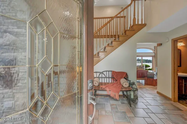 a bathroom with a bathtub and a large window
