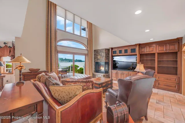 a view of a workspace with furniture window and wooden floor