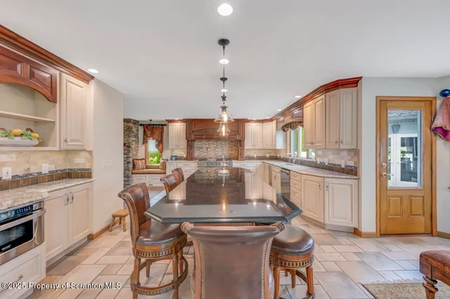 a view of walk in closet with clothes