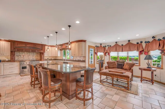 a kitchen with refrigerator a stove a sink and dishwasher