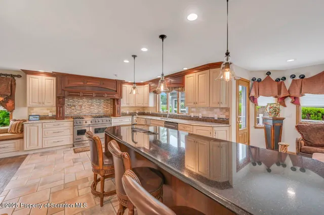 a bathroom with a shower curtain and a sink
