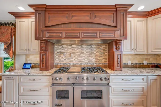 a view of washer and dryer with bathroom in the background