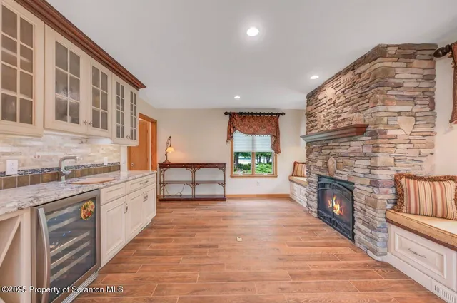 a view of a balcony with two chairs and a table