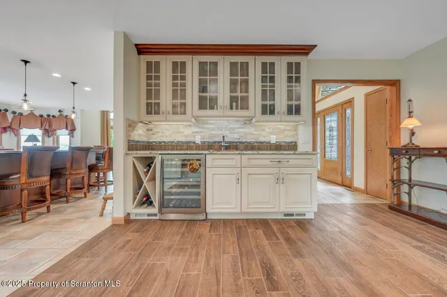 a house with a big yard and large trees