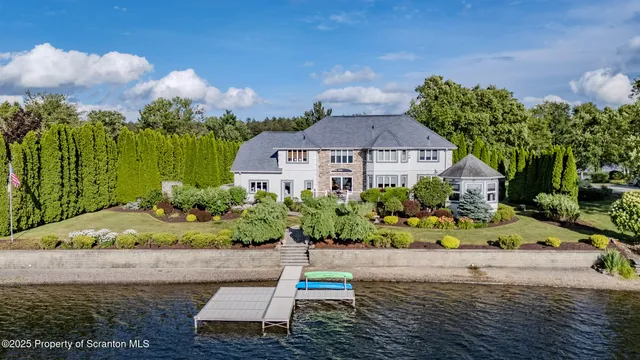 a view of a livingroom with furniture and staircase