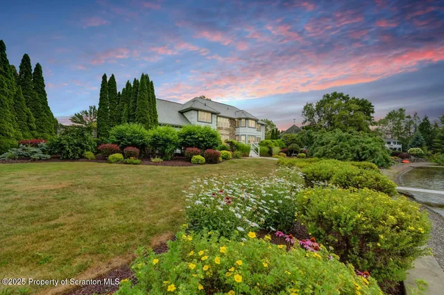 a bathroom with a toilet a sink and a mirror