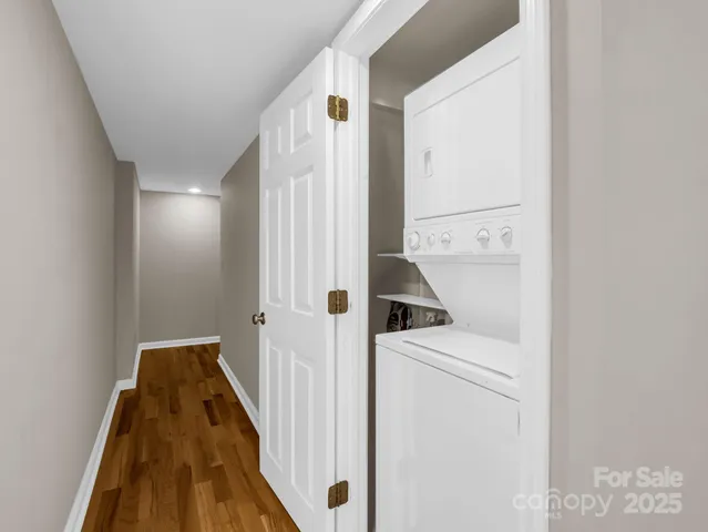 a view of a hallway with washer and dryer