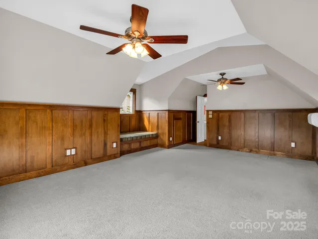 a view of a livingroom with a ceiling fan and window