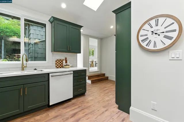 a kitchen with a sink and a stove