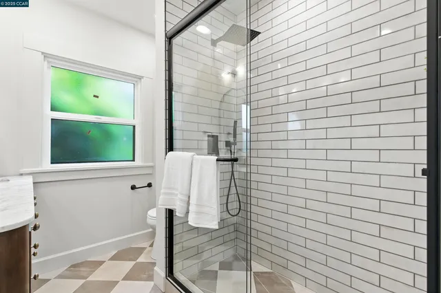 a bedroom with a bed and a table