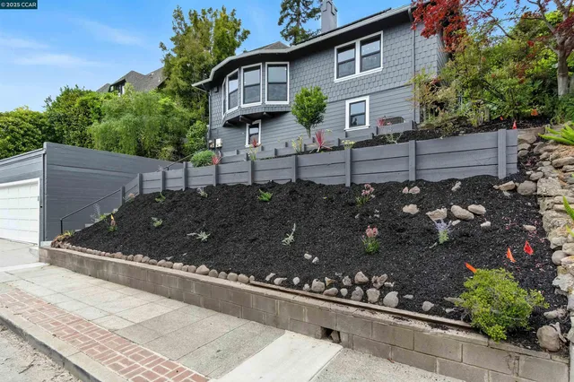 a front view of a house with garden