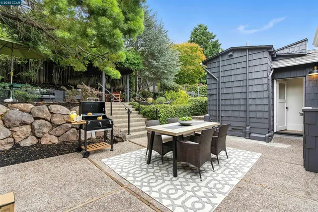 a view of a backyard with sitting area