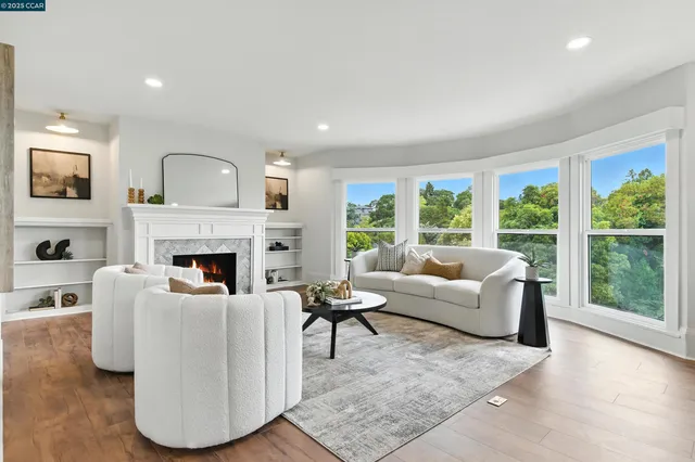 a living room with furniture and a large window
