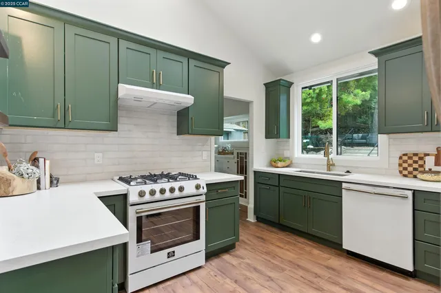 a kitchen with a refrigerator and a sink