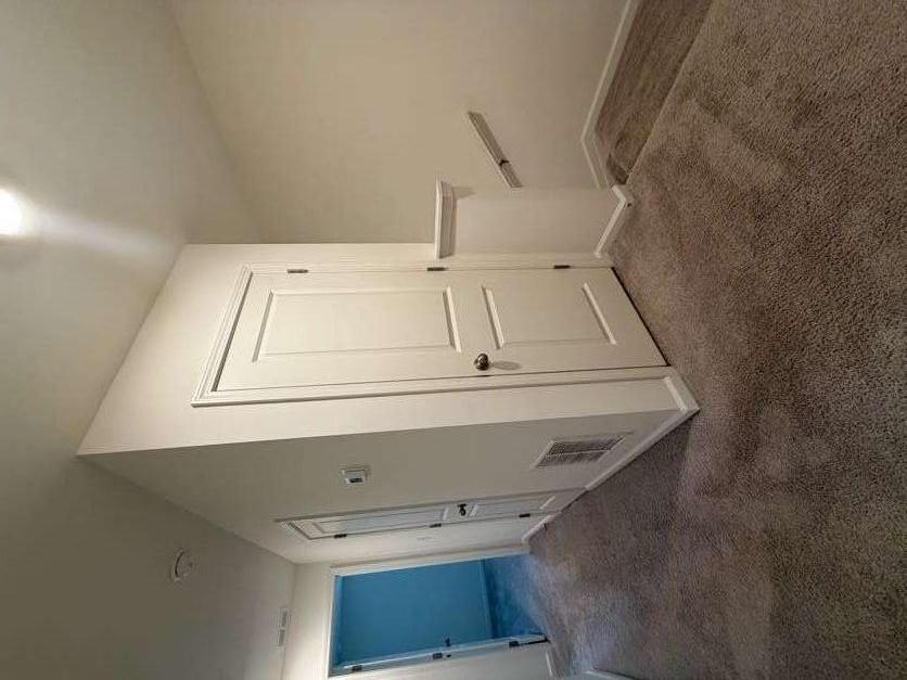35300 Condor Court Atlanta, GA 30331 - Photo 12 of 31 an empty room with white cabinet and mirrors