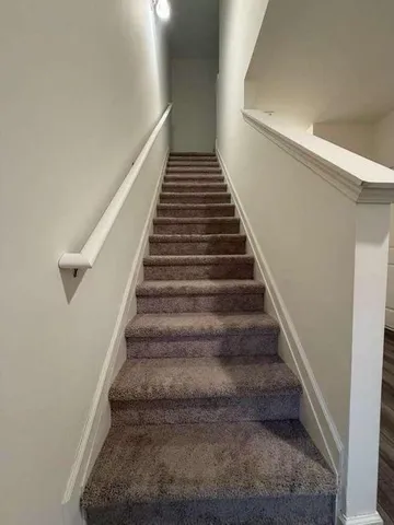 a view of an empty room and a window