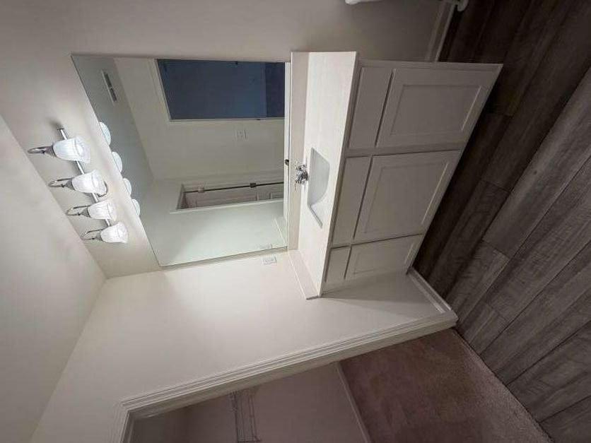 35300 Condor Court Atlanta, GA 30331 - Photo 16 of 31 a bathroom with a double vanity sink and a mirror