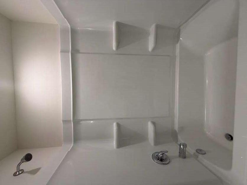 35300 Condor Court Atlanta, GA 30331 - Photo 17 of 31 a bathroom with a bathtub