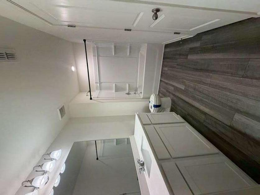 35300 Condor Court Atlanta, GA 30331 - Photo 18 of 31 a bathroom with a sink a mirror and a shower