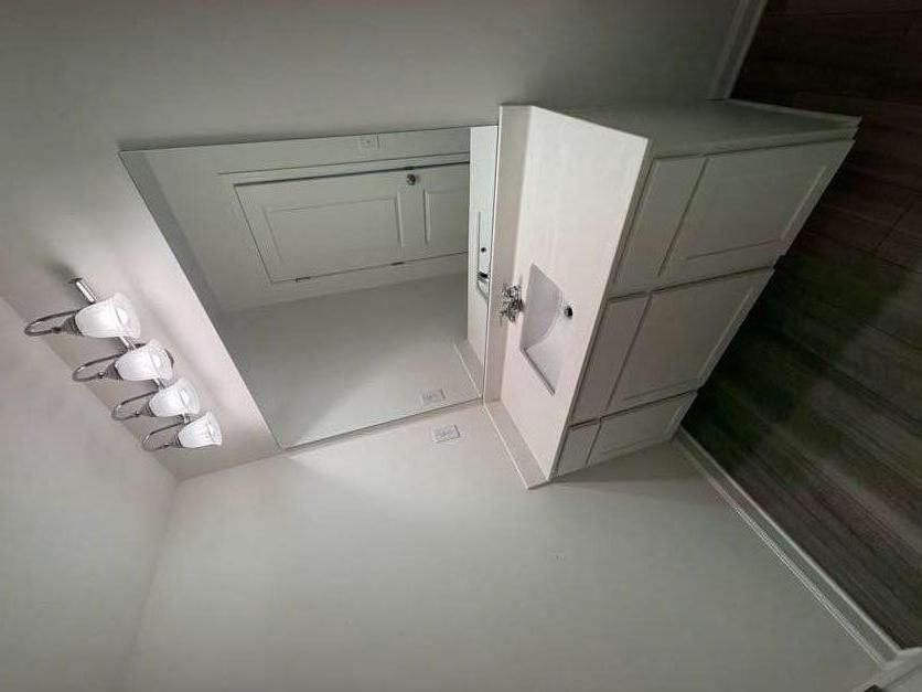 35300 Condor Court Atlanta, GA 30331 - Photo 22 of 31 a bathroom with a sink and a mirror