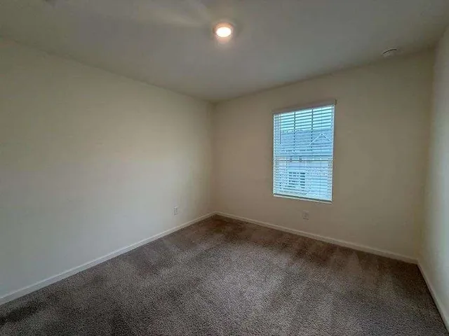 an empty room with closet area
