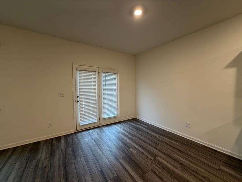 35300 Condor Court Atlanta, GA 30331 - Photo 6 of 31 a view of an empty room with wooden floor