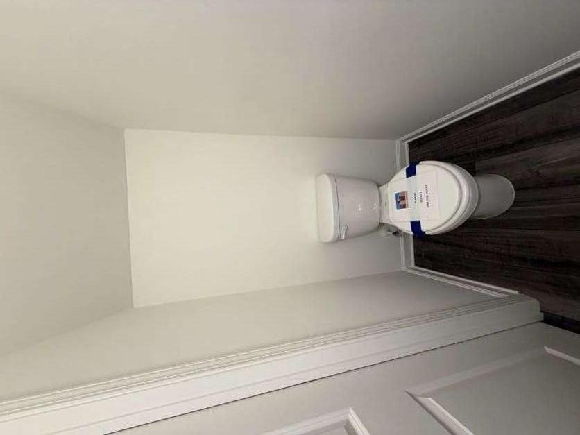 35300 Condor Court Atlanta, GA 30331 - Photo 8 of 31 a white toilet sitting next to a small sink