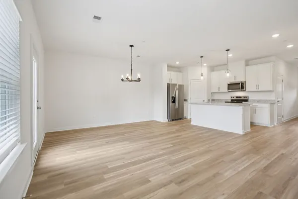 a view of kitchen with wooden floor