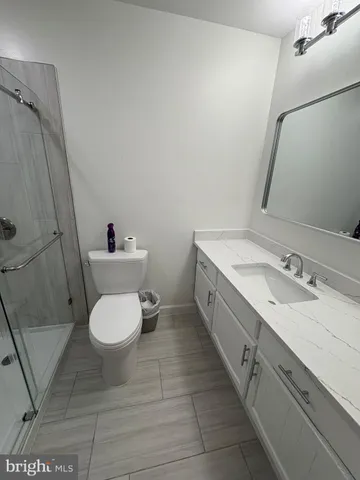 a bathroom with a sink a toilet and a bathtub