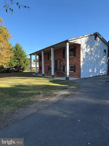 a view of a house with a big yard