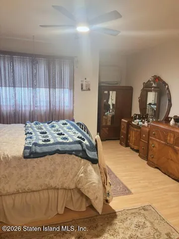 a bed sitting in a bedroom and dressers
