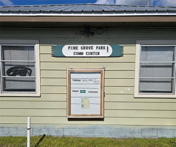 a view of a door of the house and car parked