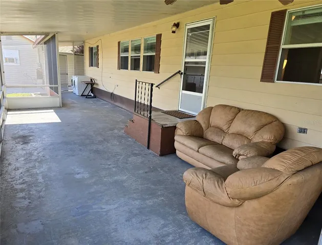 a living room with furniture and a window