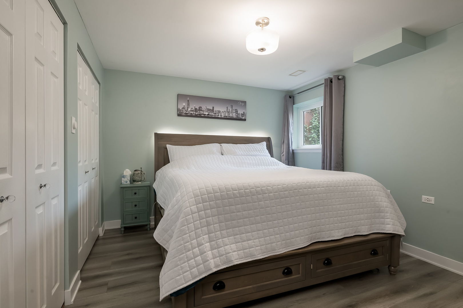 2749 North Spaulding Avenue, Unit GN Chicago, IL 60647 - Photo 19 of 40 a room with a bed and wooden floor