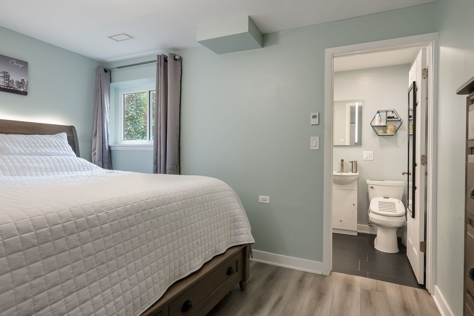 2749 North Spaulding Avenue, Unit GN Chicago, IL 60647 - Photo 20 of 40 a spacious bedroom with a bed and a view of bathroom