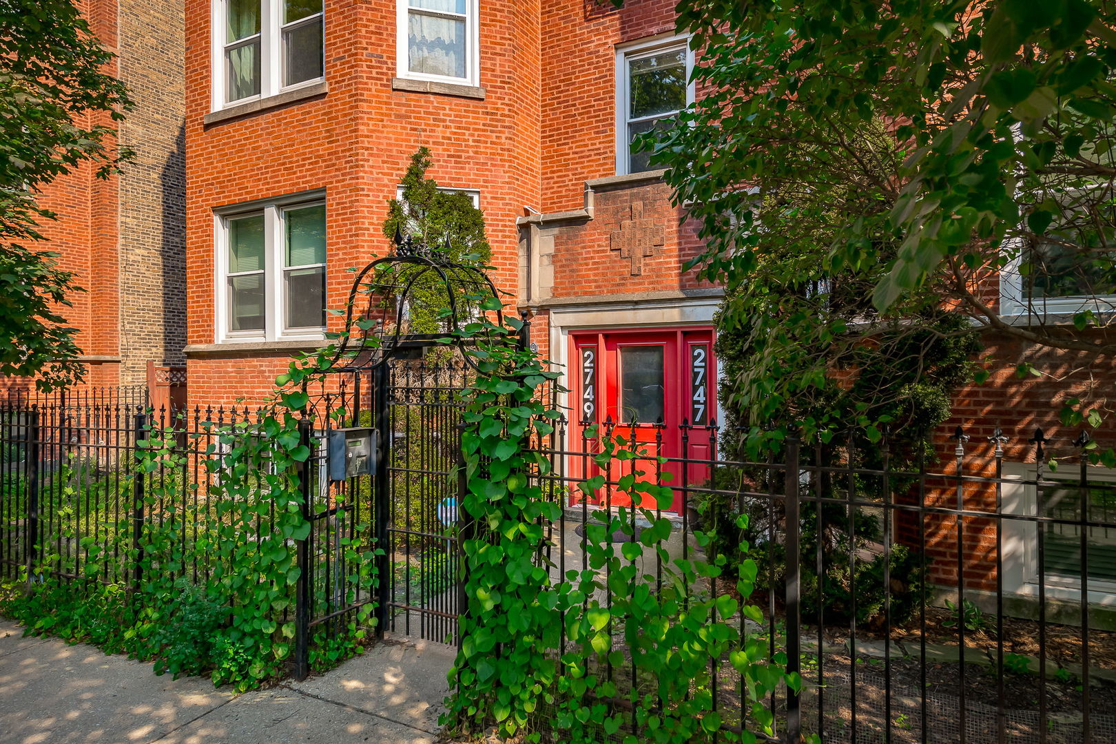 2749 North Spaulding Avenue, Unit GN Chicago, IL 60647 - Photo 2 of 40 front view of a house with a small yard