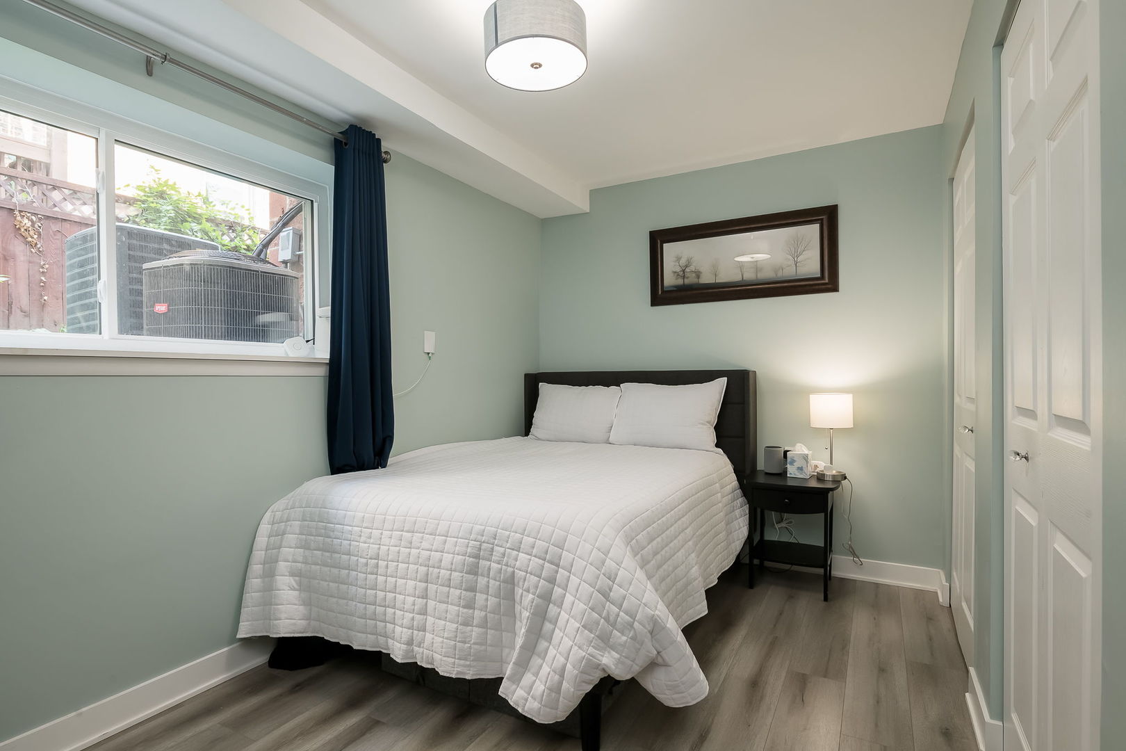 2749 North Spaulding Avenue, Unit GN Chicago, IL 60647 - Photo 21 of 40 a bedroom with a bed and wooden floor