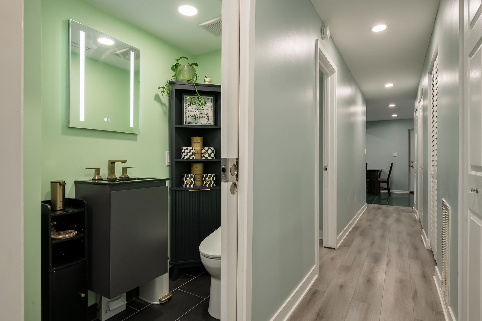 2749 North Spaulding Avenue, Unit GN Chicago, IL 60647 - Photo 23 of 40 a bathroom with a sink and a mirror