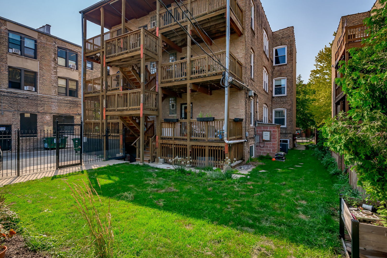 2749 North Spaulding Avenue, Unit GN Chicago, IL 60647 - Photo 31 of 40 a view of a house with a yard and sitting area